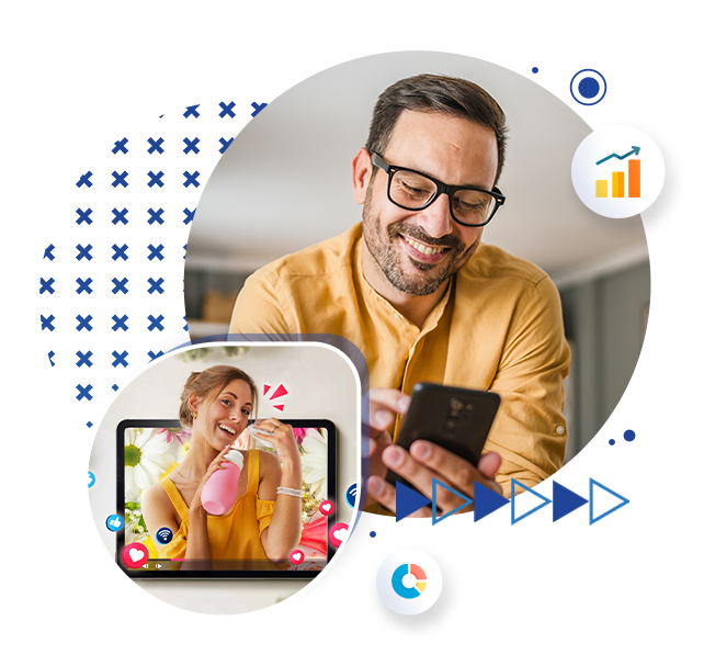 A man smiling at a phone screen and an image of a woman smiling, holding a water bottle on a laptop screen